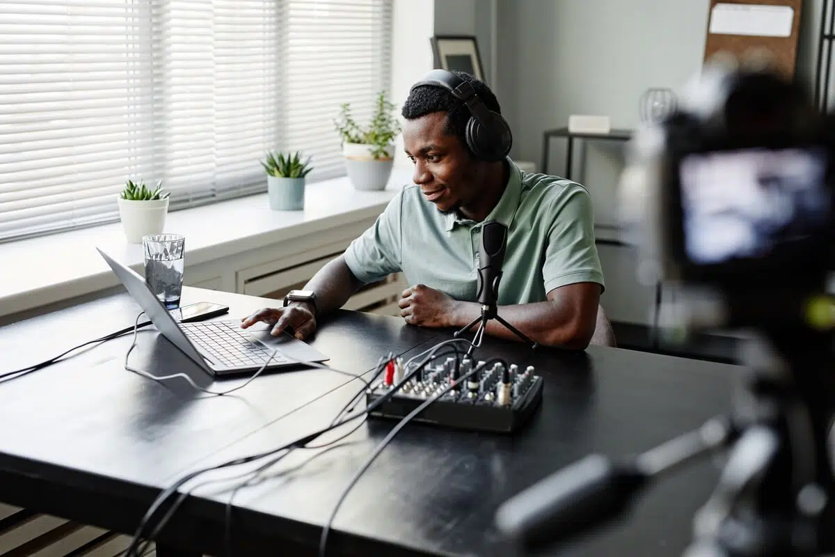 influencer-at-desk.jpg Influencer Producing Podcast Content